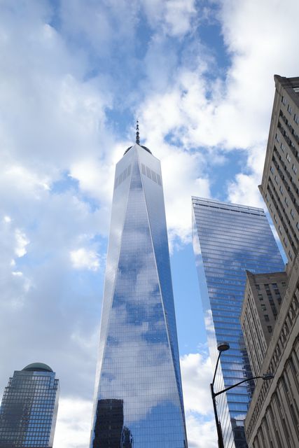 One World Trade Center rising into broken cloud